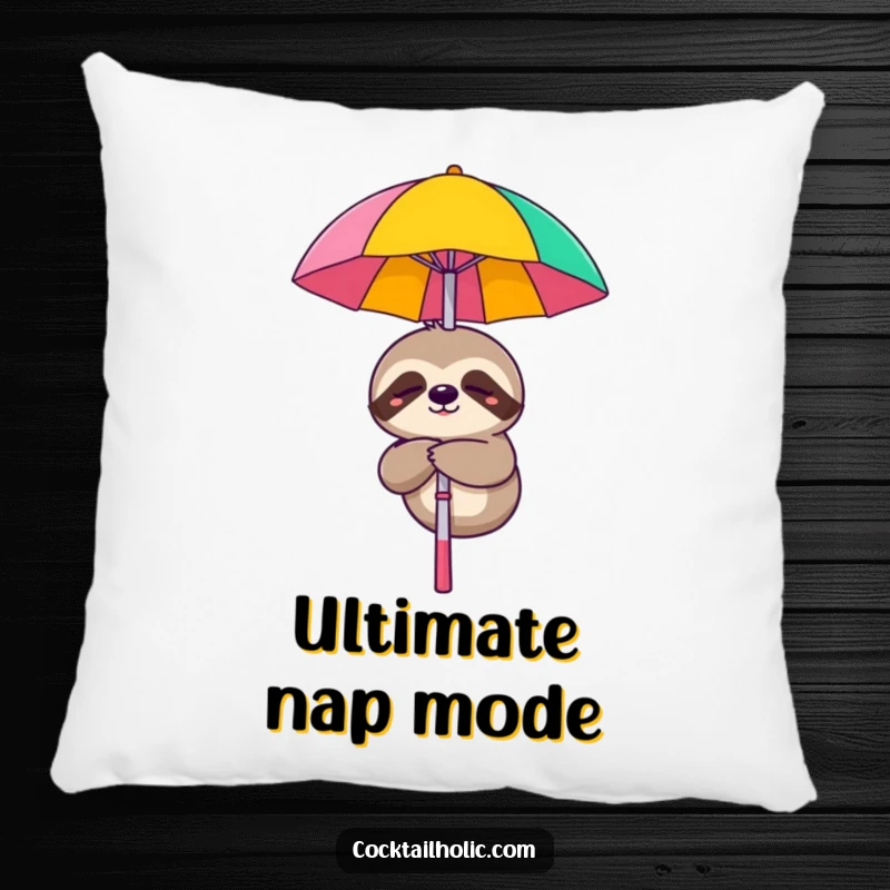 Funny pillow with a sleepy sloth character smiling while dangling from a cocktail umbrella, adding humorous comfort.