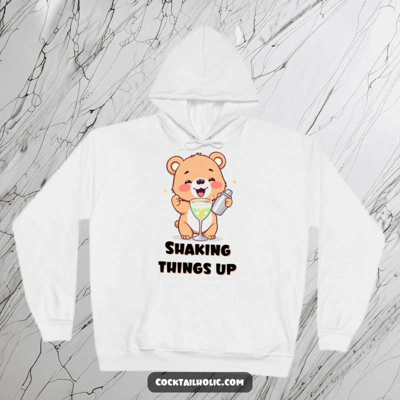 Funny bear cub hoodie gleefully shaking a cocktail shaker, a cozy and humorous piece for cold days.