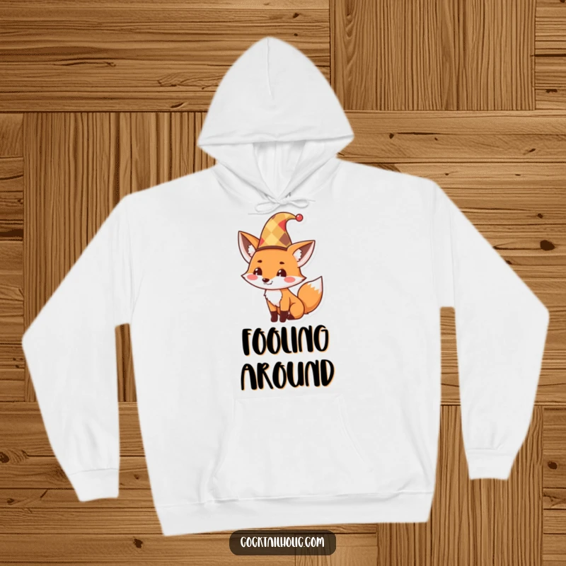 Funny Hoodie featuring a cute fox adorned in a jester hat, tipping it with a mischievous grin, offering cozy humor and style.