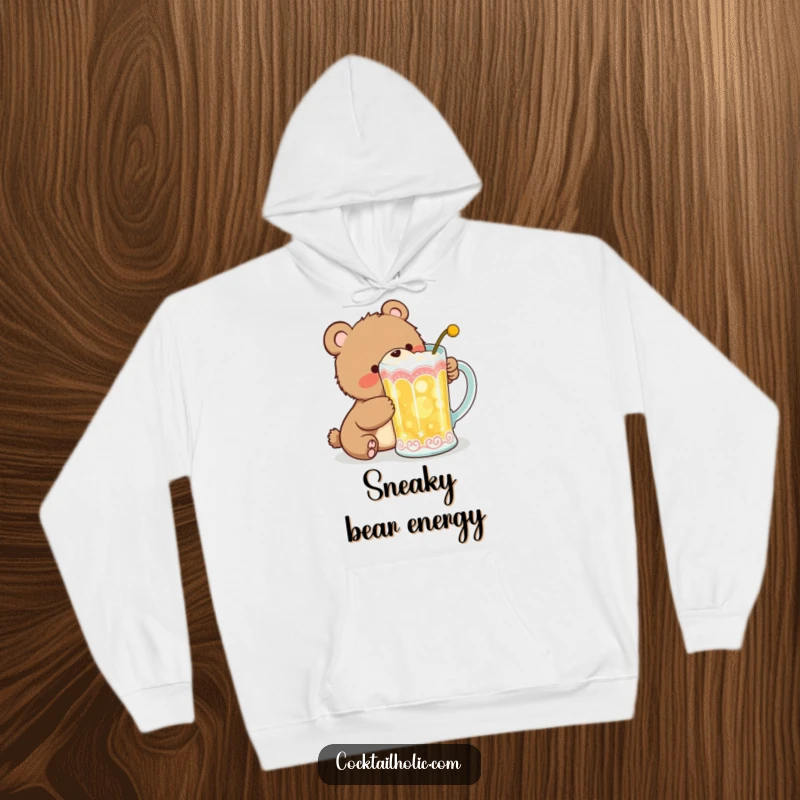 Funny Hoodie featuring a giggling bear cub attempting to sneak a gulp from a large, decorative cocktail mug, designed for ultimate comfort.