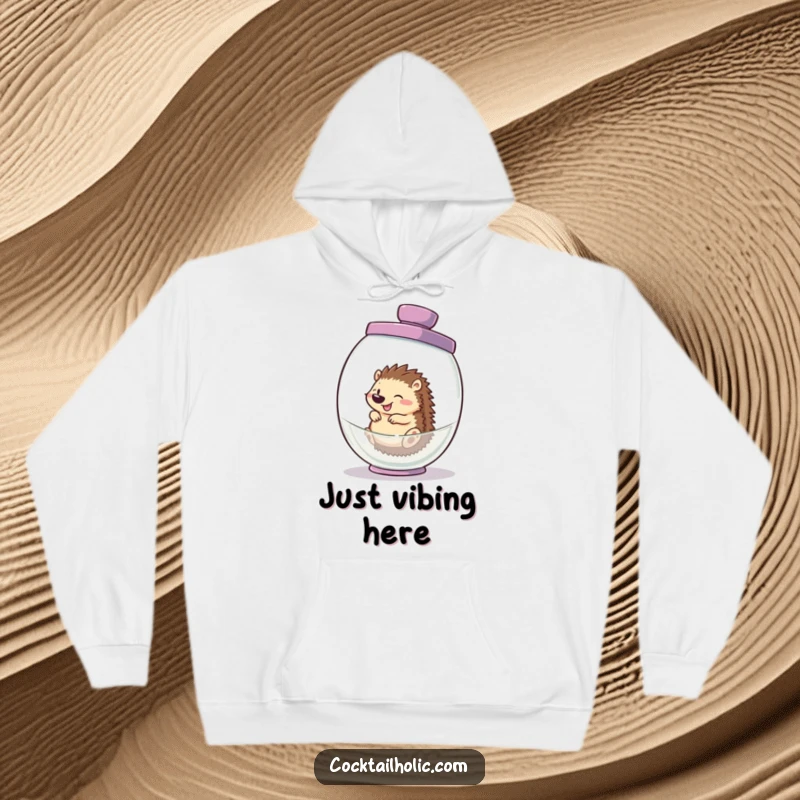 Funny hedgehog hoodie, joyfully tumbling within an oversized cocktail shaker, a cozy and comical scene for all.