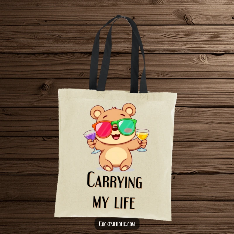 Funny Tote Bag featuring a happy, rosy-cheeked cartoon bear juggling oversized, colorful cocktail glasses, ready for adventure and a good laugh.