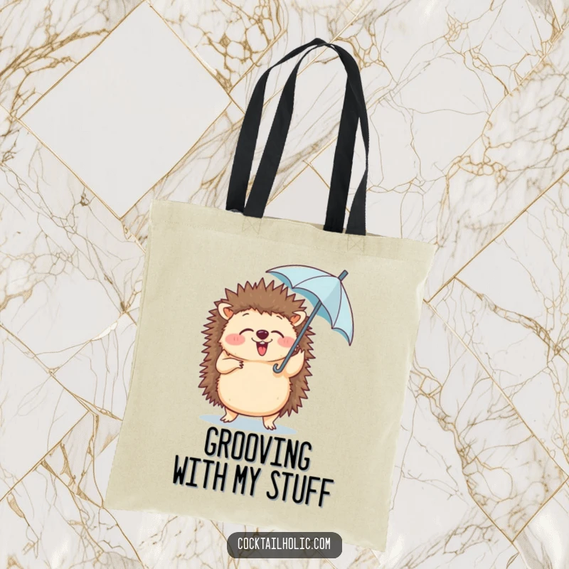 Funny tote bag showing a giggling hedgehog doing a silly dance while holding a tiny umbrella in its paw.